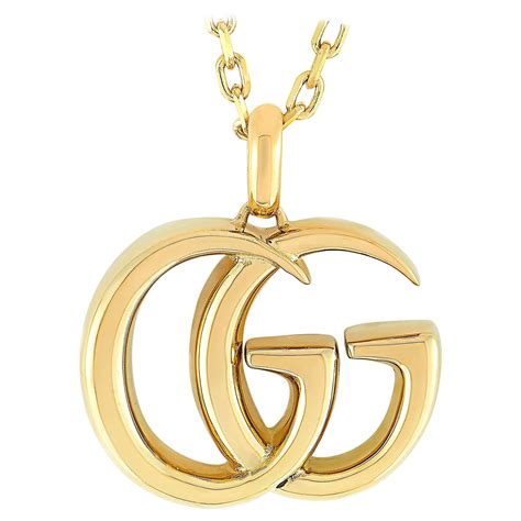 gucci gg running pendant necklace yellow gold|Gucci silver and onyx necklace.